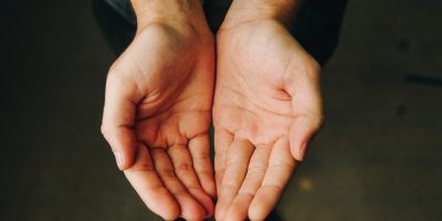 persons hand forming heart